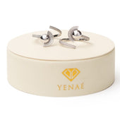 Yenaé Rhodium plated Tsirur Ring displayed on package.