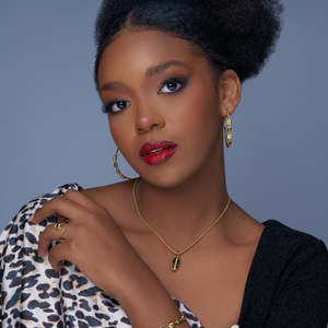 Gold-plated statement hoop earring with textured oval charms