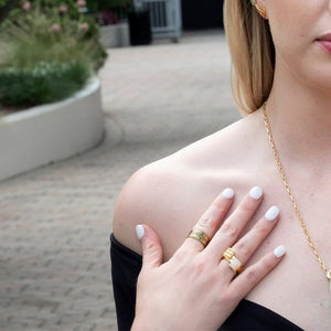 Yenaé Jewelry Collection 14 carat gold plated semi-precious quartz gemstone Teslom Stackable Ring worn by a model.