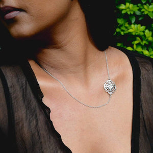 A Model Wearing Yenaé Rhodium Plated Axum Side Cross Pendant Necklace