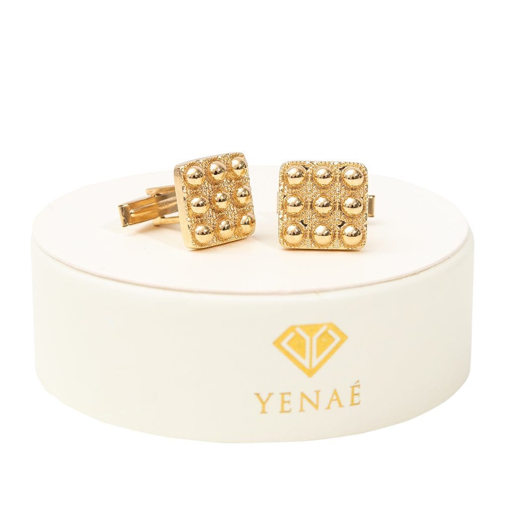 Yenaé 14K Gold Plated Telsom Dome cufflink displayed on package.