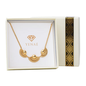 Yenaé 14K real gold Tsirur Statement Necklace displayed in a box.