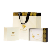 Yenaé Gift Ready Packaging Displayed with a Packaged Cross Necklace